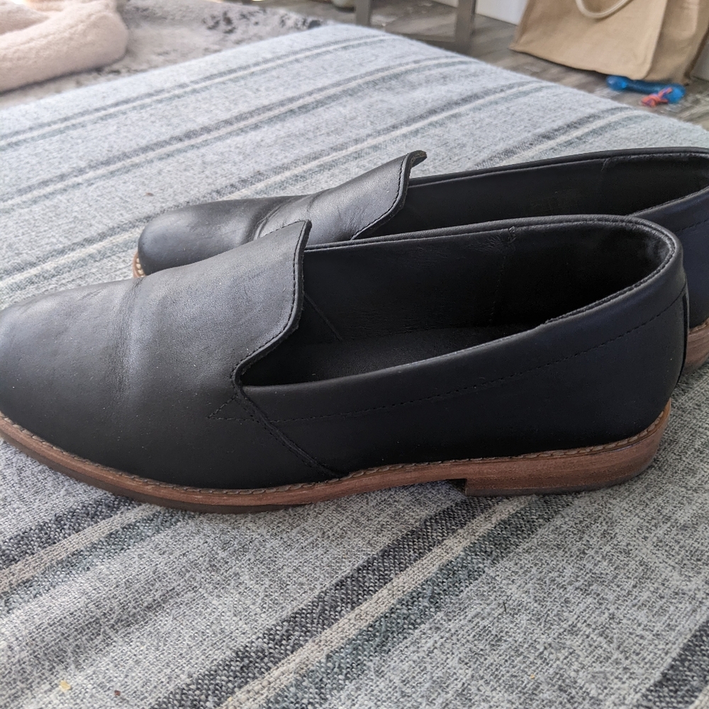 Black leather flats